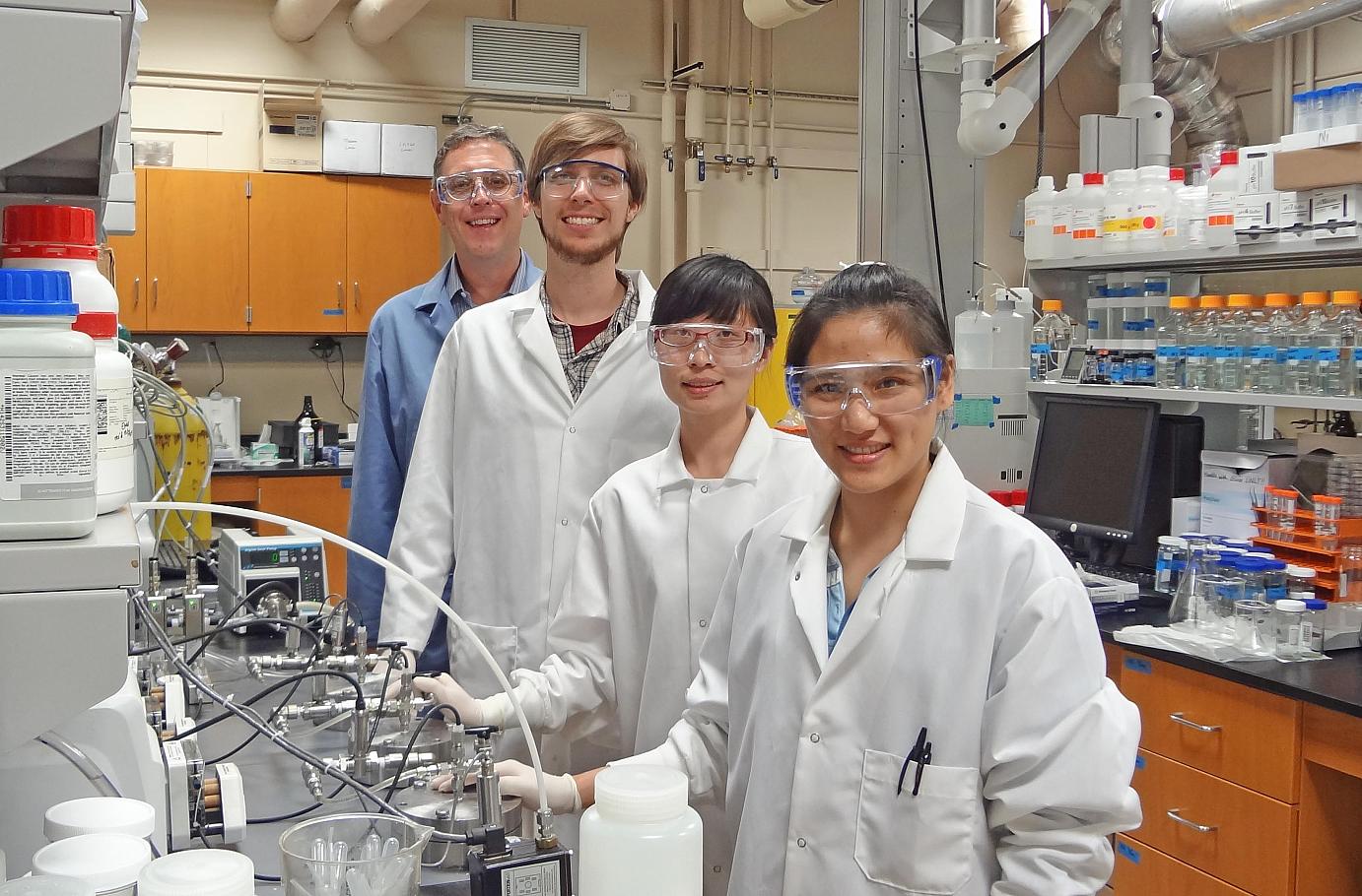 Professor Benny Freeman and researchers Dan Miller Zhengwang He and Sirirat Kasemset in the lab