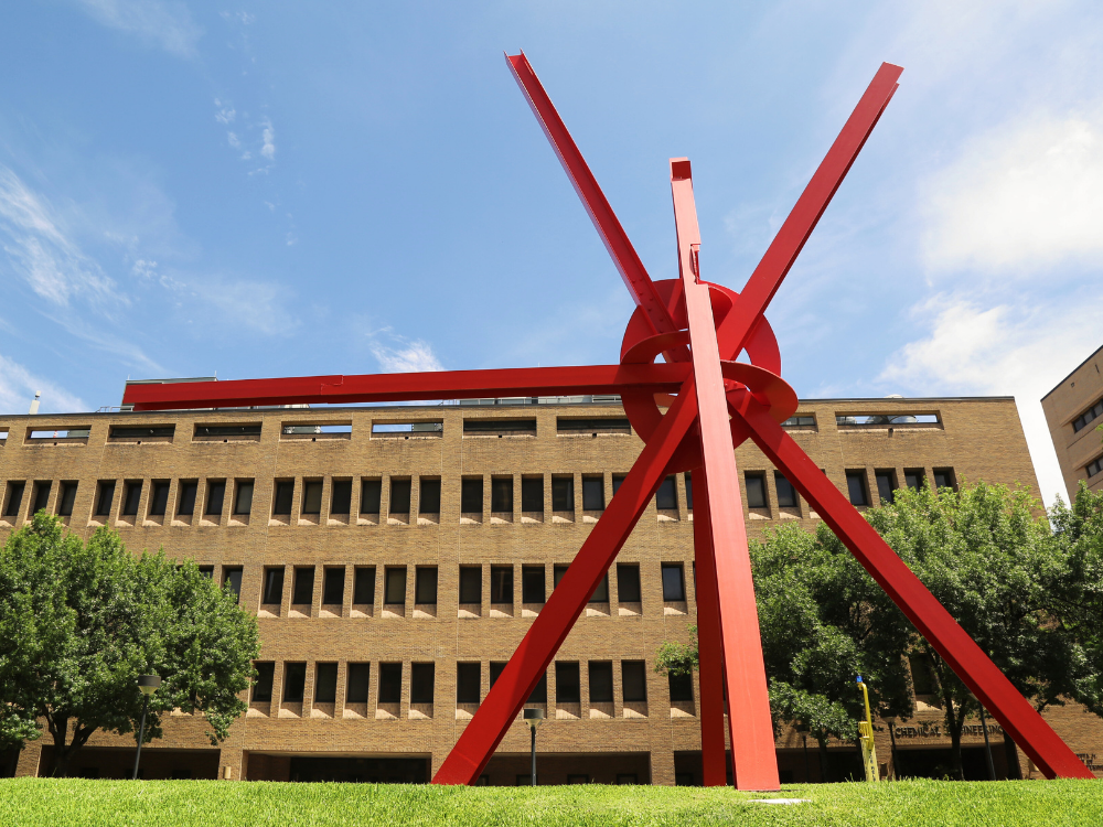 Outside of CPE - UT Austin's chemical and petroleum building with clock knot sculpture