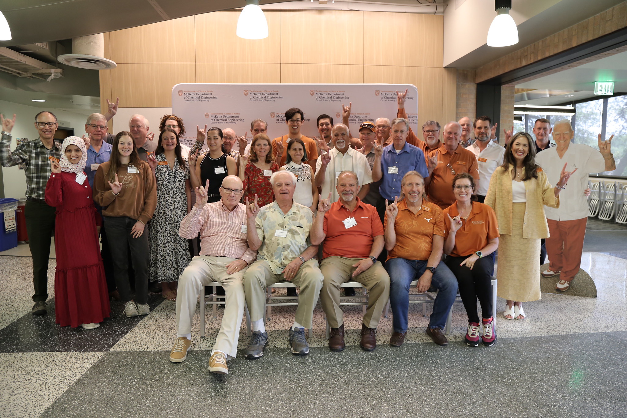Dr. McKetta's students return for the McKetta Luncheon and smile as a group