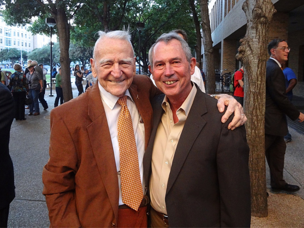 Dr. McKetta and Dr. Paul smile outside of CPE building on UT campus